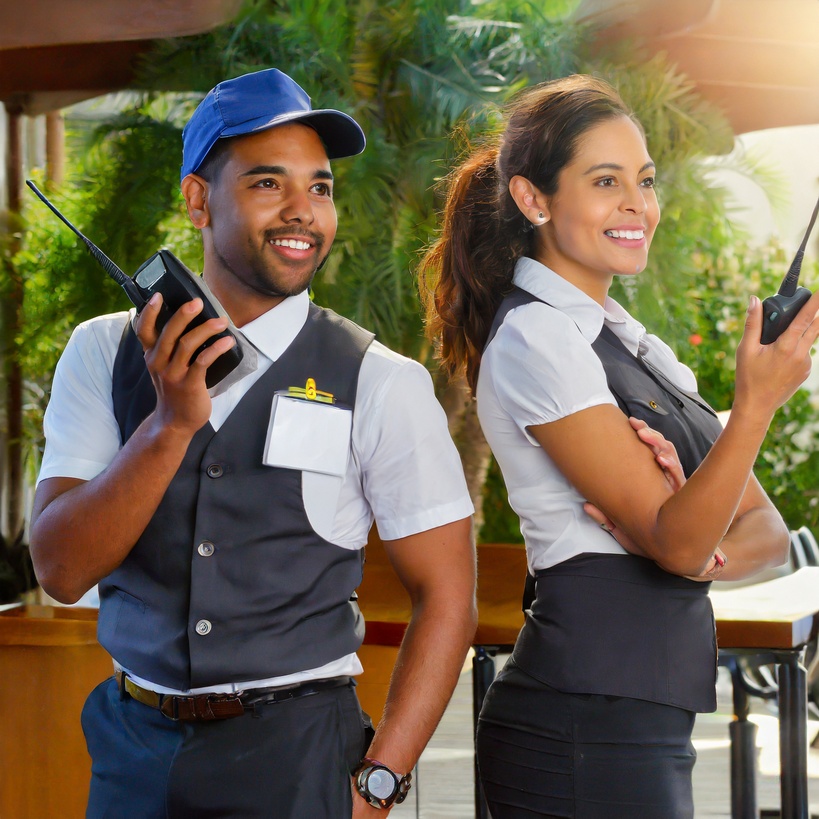 Hospitality industry workers with two-way radios.